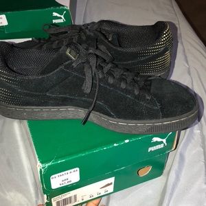 Black and Gold Suede Pumas